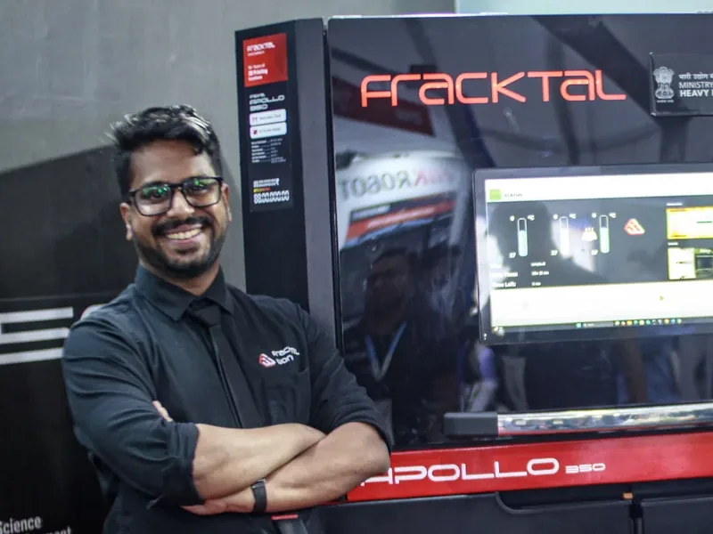 Vijay beside the Apollo 350 SLS printer on the Fracktal stand at IMTEX.