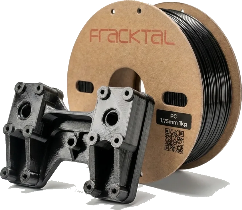 Black printed engineering brackets beside a Fracktal filament spool.