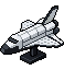 A pixel-art Lego model of Space Shuttle Discovery on its stand.
