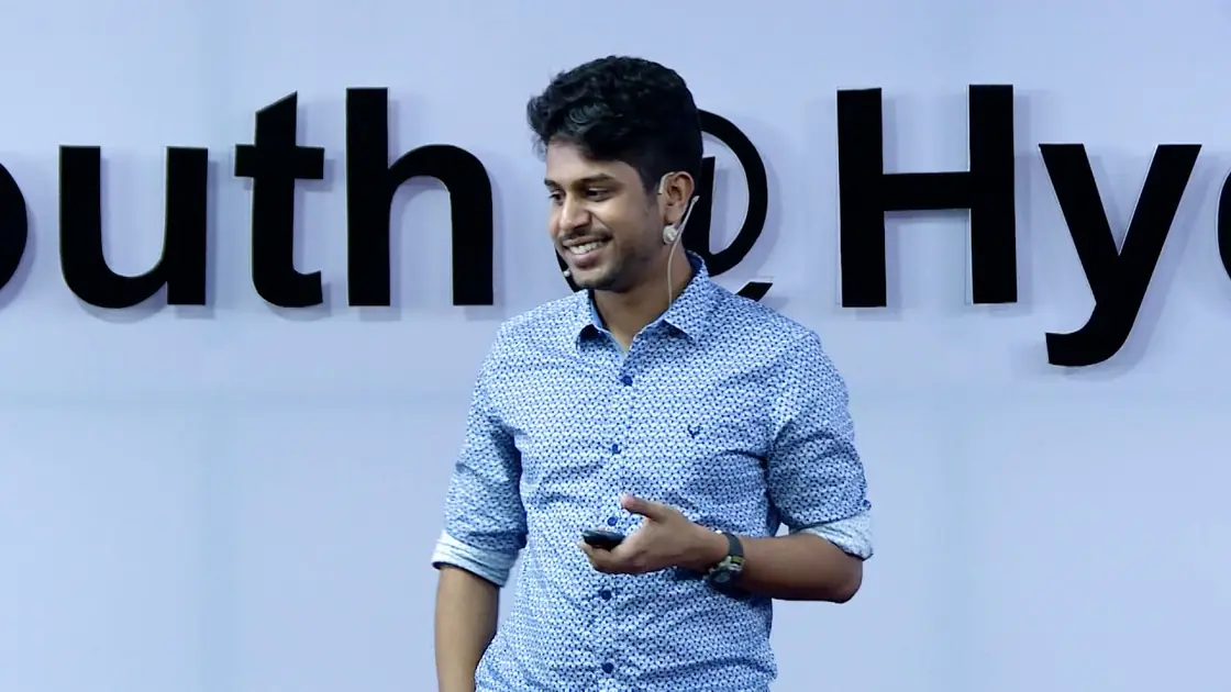 Vijay Raghav Varada speaking on the TEDxYouth@Hyderabad stage, the event lettering behind him.